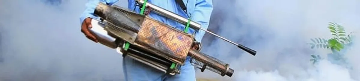 Fumigation technician using a fogger for deep pest treatment in Spokane, WA